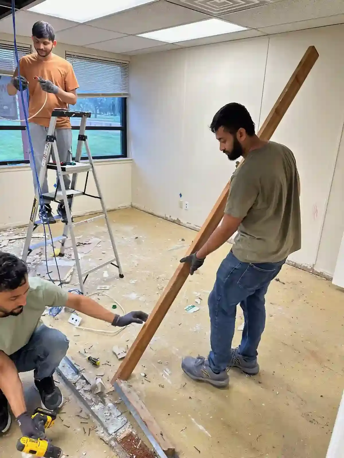 Crew removing material during an interior property project